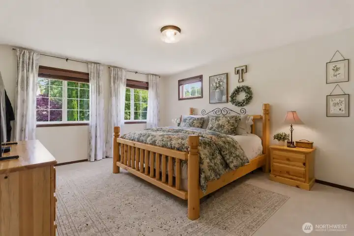 Retreat to the oversized primary suite featuring exceptional space, relaxing atmosphere, and a beautifully appointed full bath