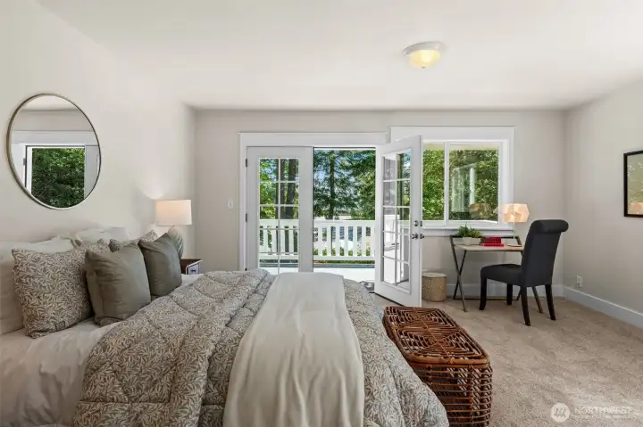 The French Doors lead out to a shared upstairs balcony with a view