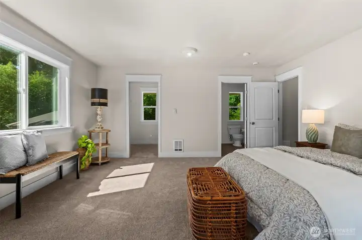 This bedroom has a large walk in closet.