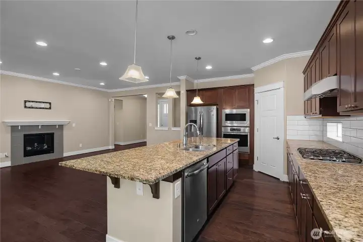 Large center island with prep sink, dishwasher and seating opens directly to the fireside great room. Large center island with prep sink, dishwasher and seating opens directly to the fireside great room.