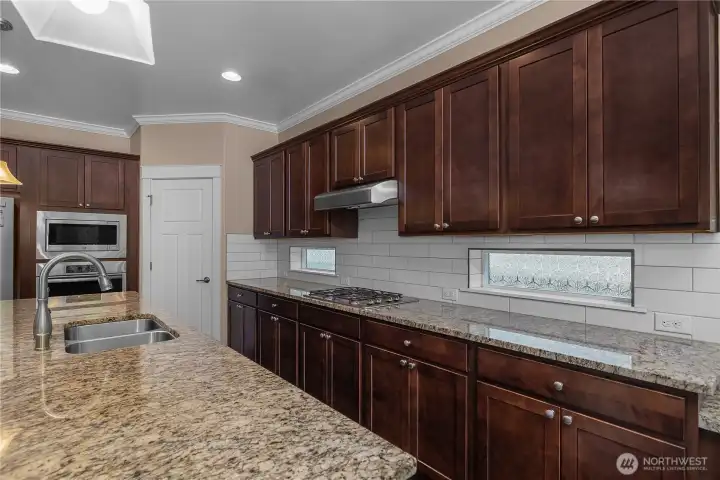 Enjoy plenty of workspace and storage while cooking in a kitchen designed for everyday convenience. Enjoy plenty of workspace and storage while cooking in a kitchen designed for everyday convenience.