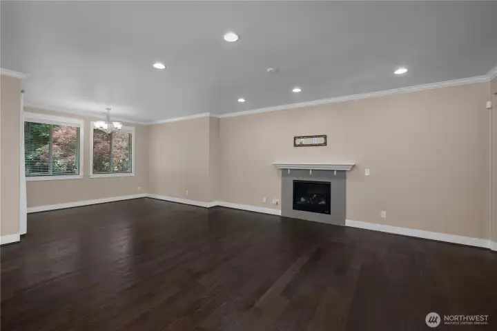Generous great room with wood-plank flooring, recessed lighting, large windows and a gas fireplace. Generous great room with wood-plank flooring, recessed lighting, large windows and a gas fireplace.