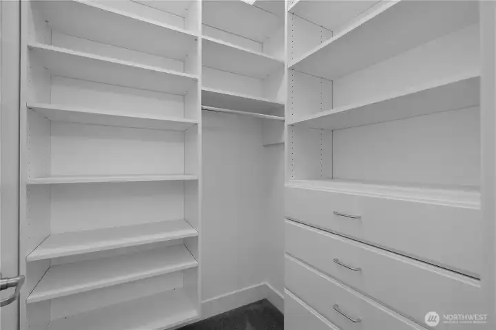 BR 3 walk-in closet - Custom walk-in closet with adjustable shelving, built-in drawers and plentiful hanging space. BR 3 walk-in closet - Custom walk-in closet with adjustable shelving, built-in drawers and plentiful hanging space.