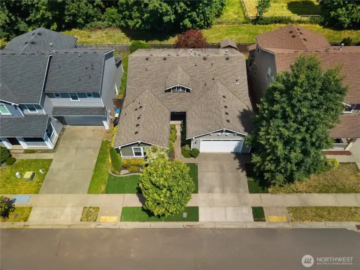 Overhead view showcases the home’s single-story layout, attached garage, landscaped entry and private backyard. Overhead view showcases the home’s single-story layout, attached garage, landscaped entry and private backyard.