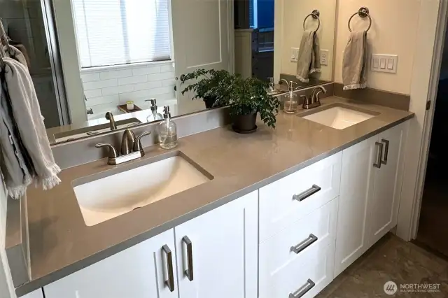 Primary bath double vanity with quartz counters.