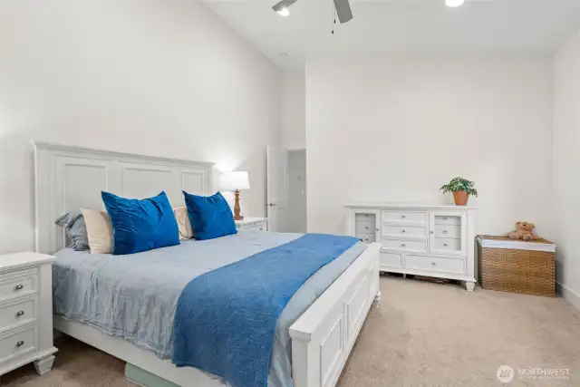 Primary bedroom is set apart from guest rooms for privacy.