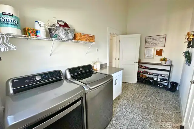 Just beyond the kitchen is the large laundry/mudroom with back door leading to back porch and 2-car garage.