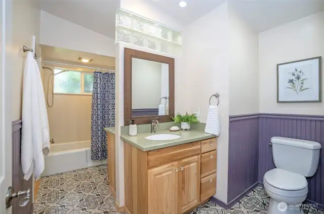 Two vanities and full bath / shower.