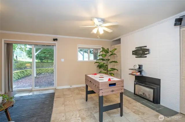 Cozy fireplace.  Details don’t stop like the crown molding and stone and tile flooring.