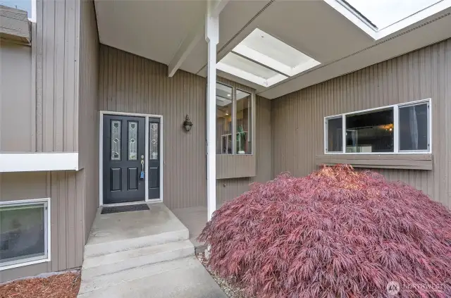 Large covered entry with skylight.
