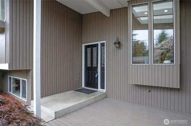 Covered front deck space to sit back and relax.