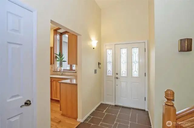Stone entry with vaulted ceilings.