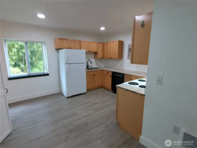 Efficient kitchen space with a roomy pantry.  Refrigerator, stove and dishwasher!