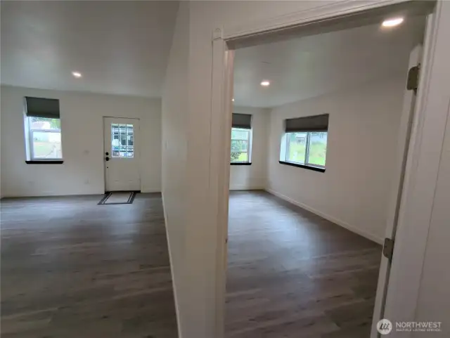 Looking toward the front door.  Living room to the left and the main bedroom to the right.