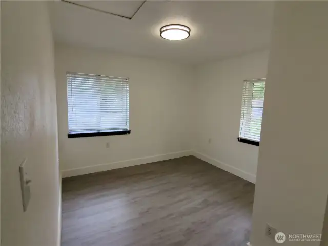 Windows offer lots of light for this bedroom on the second story.