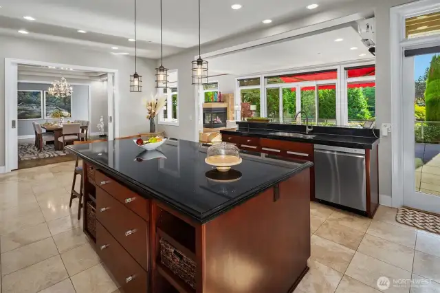 The Kitchen is the heart of the home and open to the formal Dining room, Informal dining room, Living room and a door to straight out to the deck