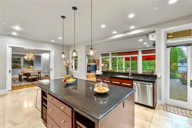 The Kitchen is the heart of the home and open to the formal Dining room, Informal dining room, Living room and a door to straight out to the deck