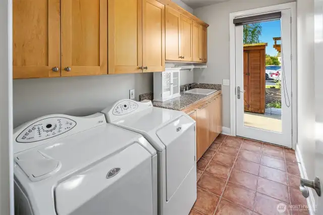 Main floor Laundry room right off the indoor pool and outside access