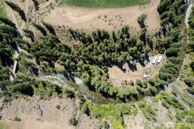 The property has approximately 800 feet of private river frontage with numerous level clearings.