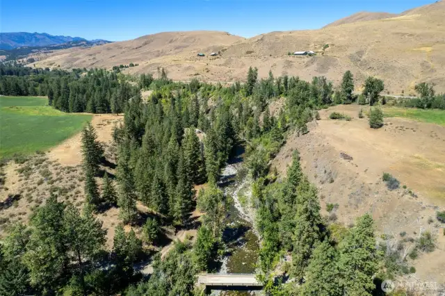Nestled in the renowned Twisp River gorge between two large farm properties makes for a very secluded retreat.