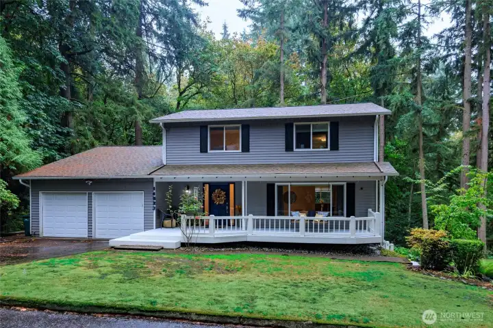 Gracious entrance, large front yard, welcoming poarch!