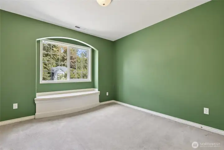 3rd bedroom w/sitting bench and storage
