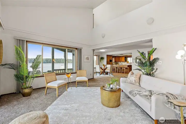 Light-filled great room with picture windows framing views of the Harstine Island Bridge and Puget Sound.