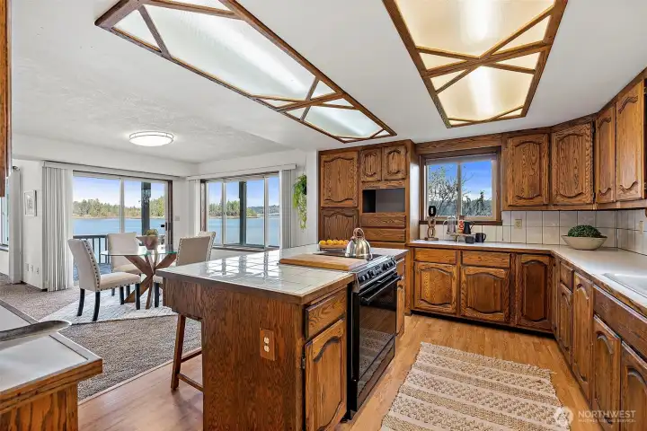 Well-appointed kitchen featuring an island, generous cabinet space, and scenic water views.