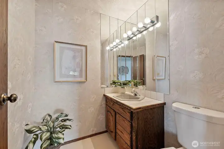Main-level powder room easily accessible from living areas.