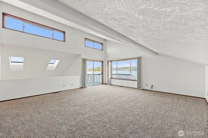 Generous bonus room upstairs featuring flexible living space and views.