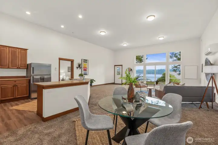 Light-filled kitchen, dining, and living areas create an open, welcoming space and those gorgeous views!