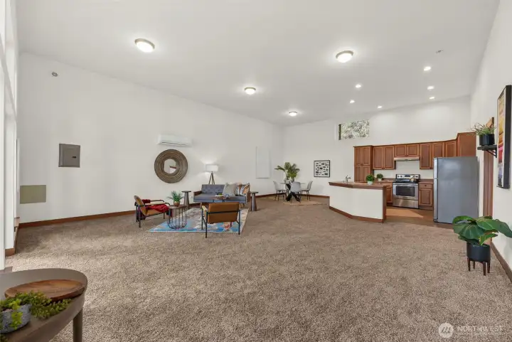 Kitchen and living room flow together in an open layout designed for everyday living and entertaining.