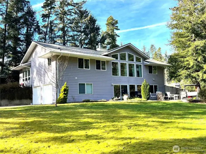BEAUTY, PRIVACY AND ACREAGE. This 3 bedroom, 2 1/2 bath custom built home sits on a little over 2 acres.