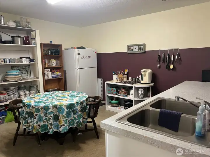 Bonus or storage room off the garage and recreational room. Kitchen sink and counter space add versatility to this space.