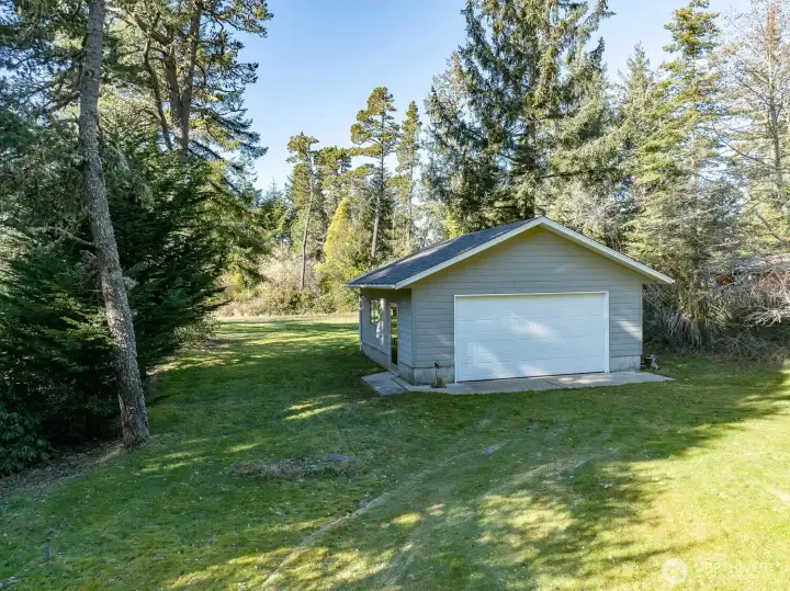 Second garage, workshop with side entrance and large window.