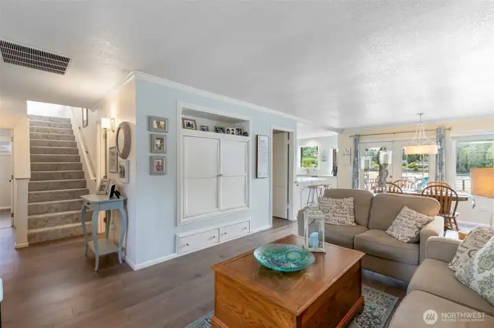 Living room and dining area. Stairs to Primary suite.