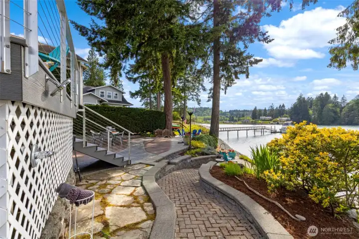 Walkway to water side of house & outdoor shower.