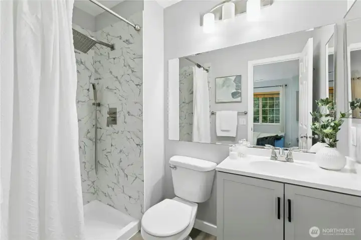 3/4 ensuite bath also comes with a new vanity, new floors, and new lighting. Plus newer tiling in the shower.
