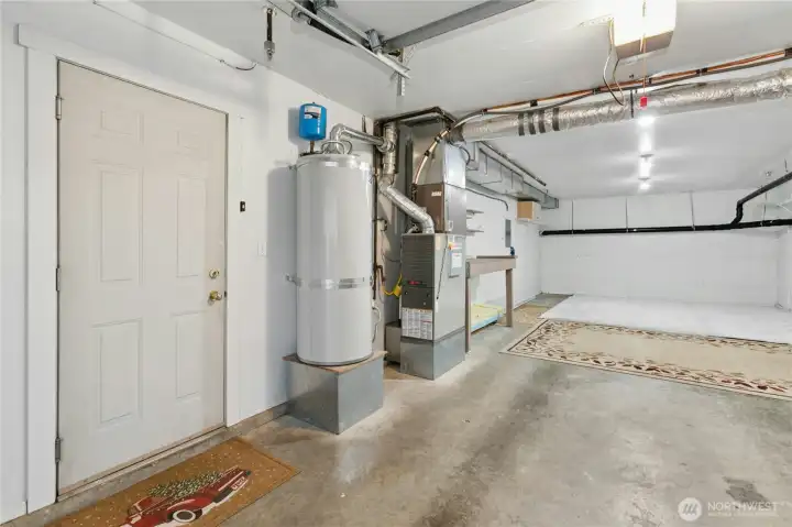 Park in the oversized two car tandem garage. Or, park outside in one of your covered spots, and finish this space to use as a rec room, exercise room, shop, or office, and still have room for storage.