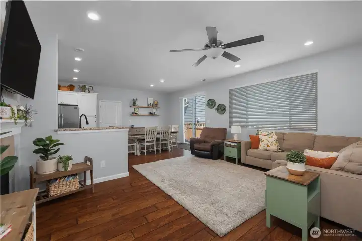 Beautiful floors, abundant lighting, and open living spaces create an inviting atmosphere for both entertaining and quiet evenings at home