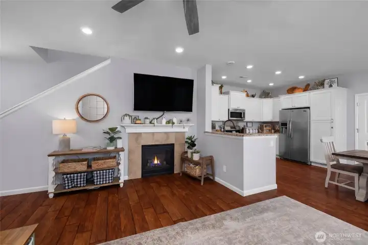 anchored by a cozy fireplace this inviting living space, blends, comfort style, and connection