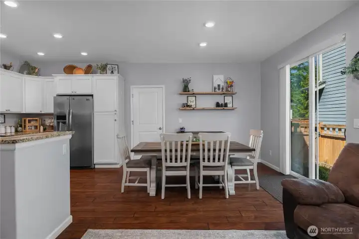 The dining area offers the perfect setting for morning coffee, dinners, and seamless indoor outdoor entertaining