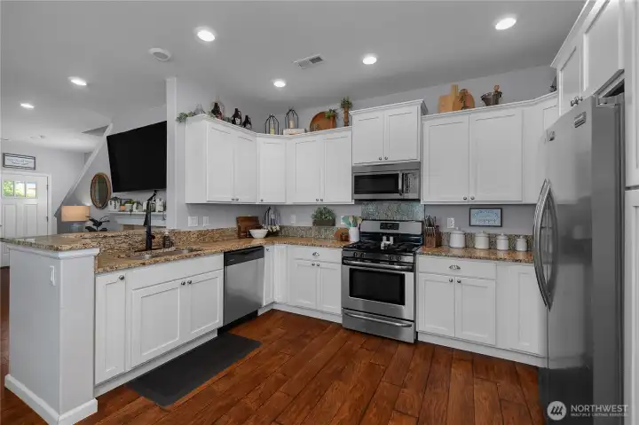 Open sightlines to the living area keep conversations flowing and make it easy to stay connected while preparing meals.