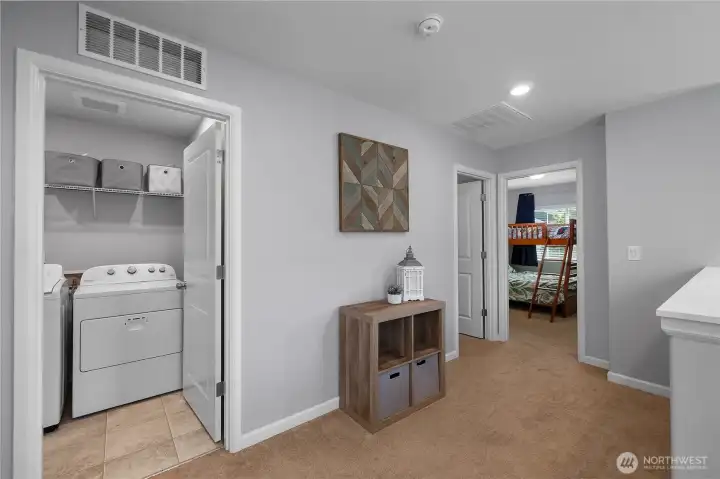 conveniently located upstairs, the laundry room keeps everyday tasks close to the bedrooms where they’re needed most