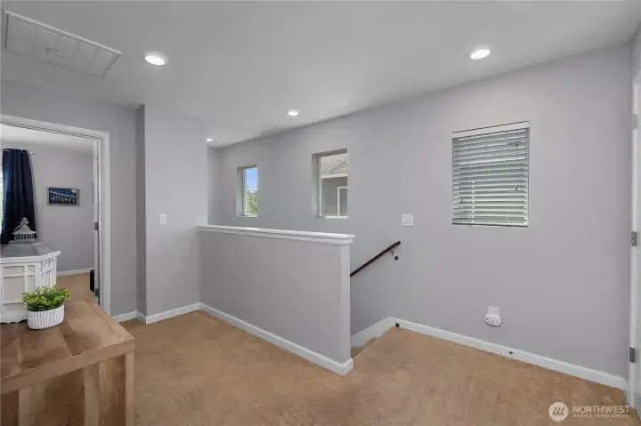 natural light fills the upper landing, creating an airy transition to the homes private bedroom spaces