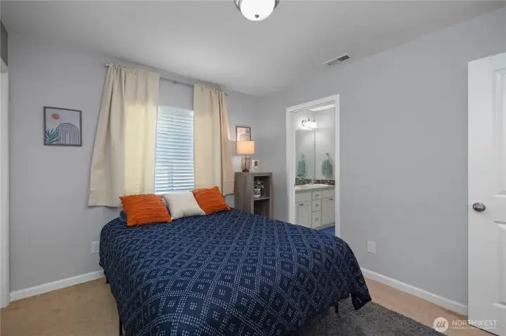 conveniently connected by a shared jack- and- Jill bath, the secondary bedrooms offer both privacy and an ideal layout for everyday living.