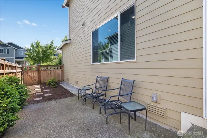 step outside to a low maintenance outdoor space perfect for morning coffee, evening conversations, are simply enjoying the fresh air.