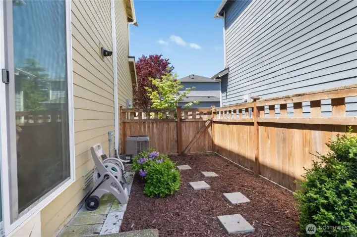 fully fenced and easy to maintain, the outdoor space provides flexibility for pets, gardening, or everyday enjoyment