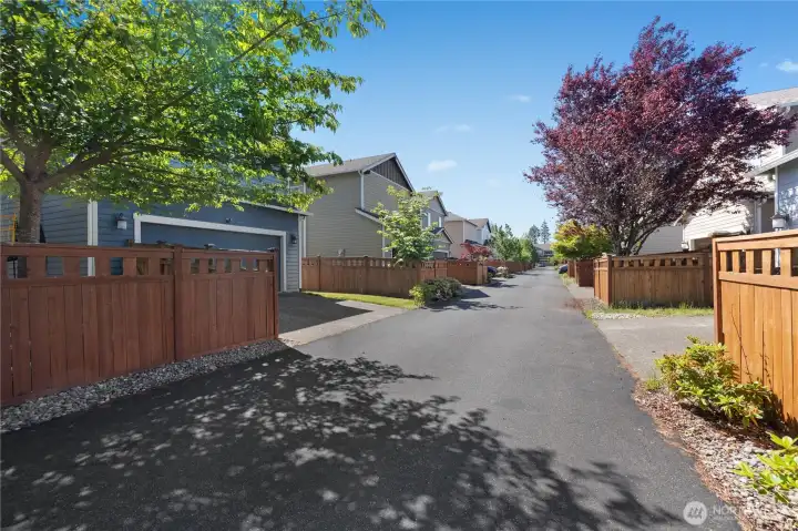 convenient alley access provides additional privacy to the garage while also enhancing curb appeal by keeping the driveway tucked neatly behind the home.