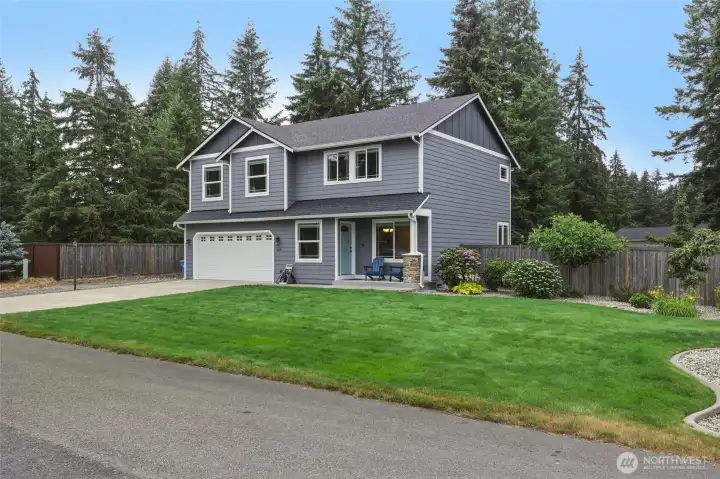 Thoughtfully designed, simple-care landscaping is highlighted by the curbing around the grass, making it easy to maintain this manicured look. Thoughtfully designed, simple-care landscaping is highlighted by the curbing around the grass, making it easy to maintain this manicured look.